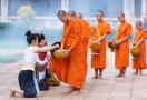 Lao monks goes begging for alms