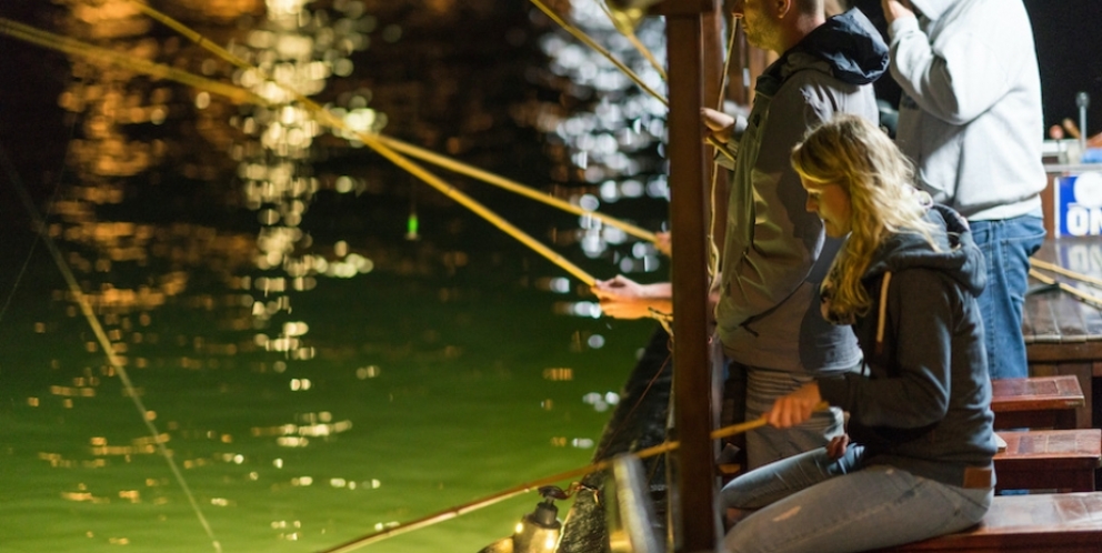 Squid fishing on boat