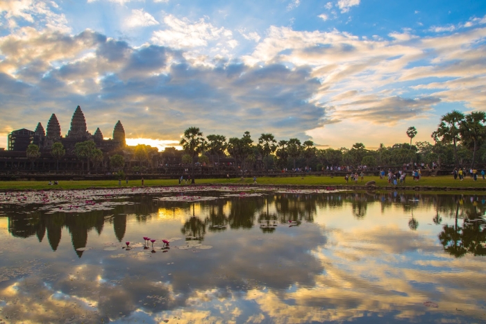 Admire the iconic sunrise at Angkor Wat