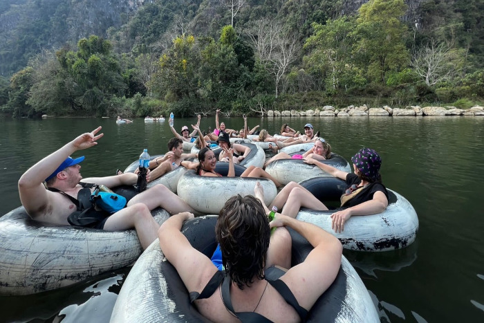 Tubing down the Nam Song River offers fun and relaxation—perfect for your 3 weeks in Laos adventure!