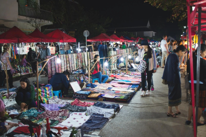 Stroll through the vibrant Luang Prabang night market, where colorful stalls offer unique Luang Prabang souvenirs