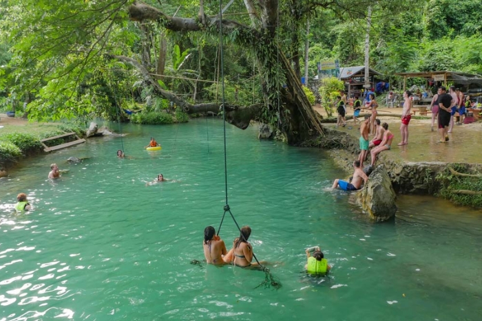 The clear blue water of the Blue Lagoon is unforgettable during Laos 15 days trip