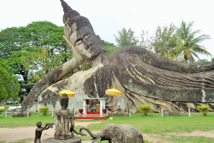 Explore the unique sculptures of Buddha Park on your Laos travel itinerary 5 days