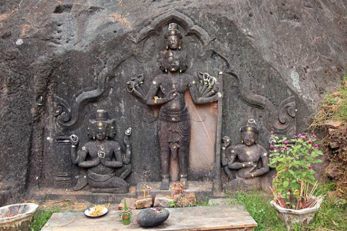 Carvings of the three supreme gods in Hinduism on the cliff behind the main temple, Upper Temple area, Vat Phou Temple