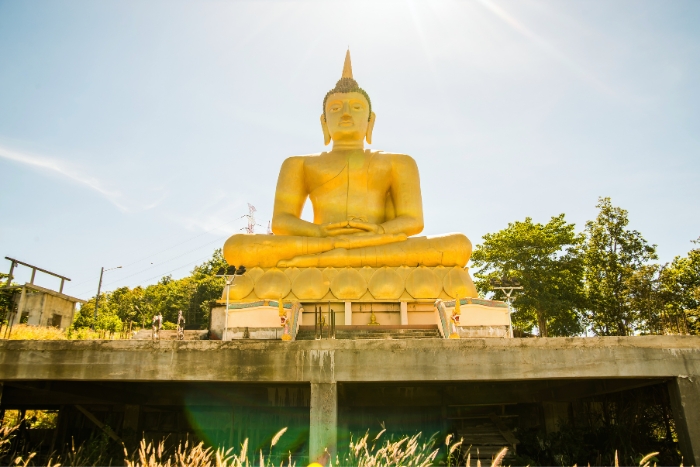 Southern Laos itinerary: Admire the stunning 30-meter golden Buddha in Pakse, a must-see spiritual landmark