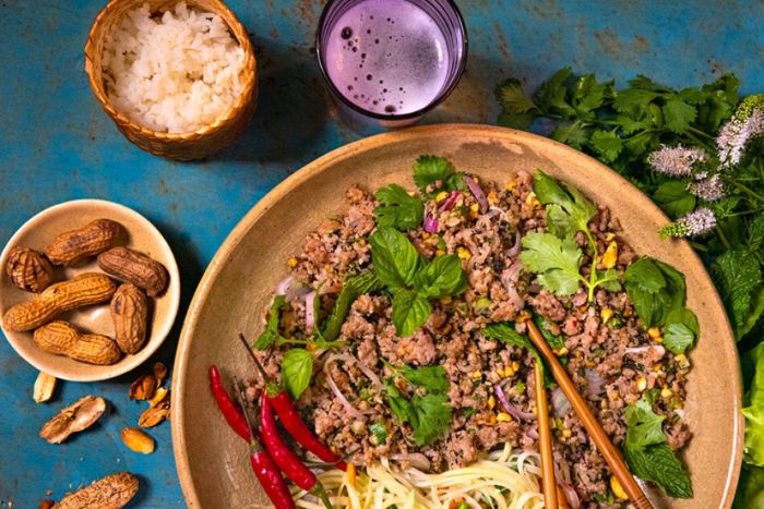 Laap, the national dish of Laos, is a meat-based salad seasoned with lime, garlic, fish sauce, and other flavorful ingredients