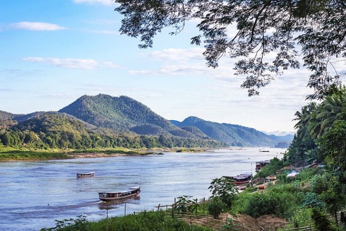 Cruising the Mekong River while traveling with a baby in Laos