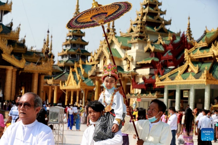 Boys in traditional attire attend the Shinbyu novitiation ceremony at Shwedagon Pagoda in Yangon, Myanmar, April 10, 2022