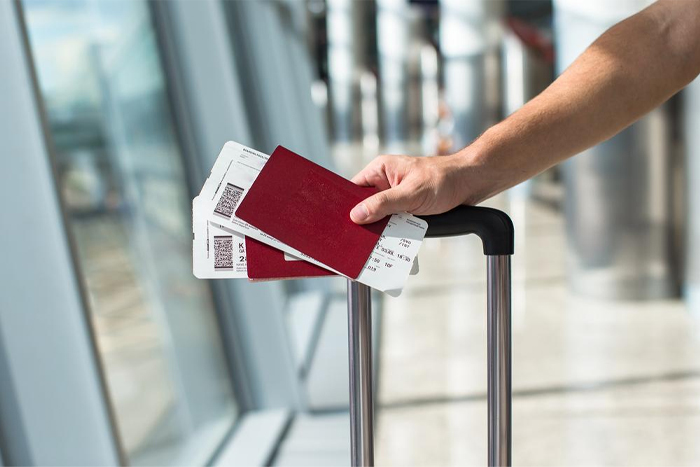 Why is a round-trip ticket important for international travel?