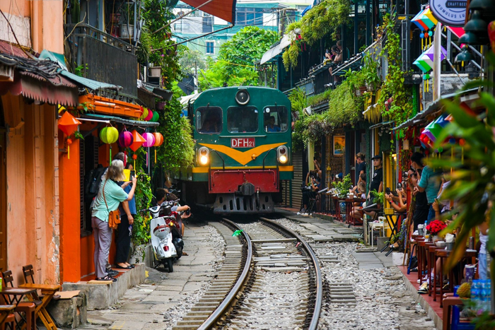 The train passes through the heart of Hanoi