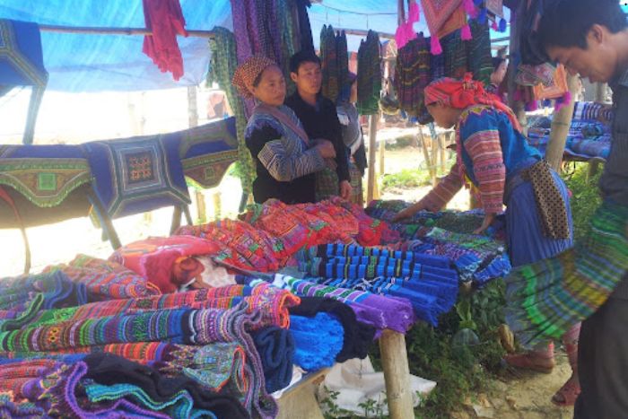 Embroidered fabrics stall at Châu Market in Sapa