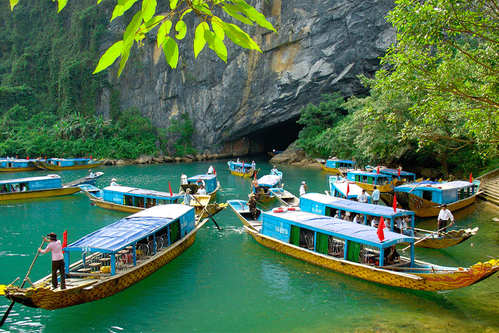 Embark on a boat ride up the river to Phong Nha Cave