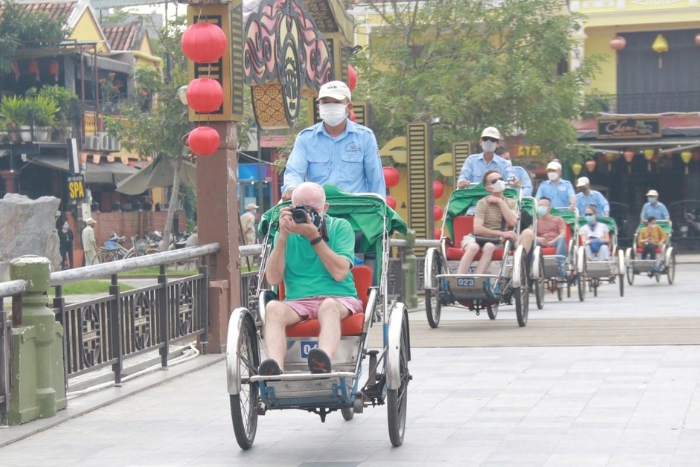 First-time tourists riding a cyclo - interesting experience