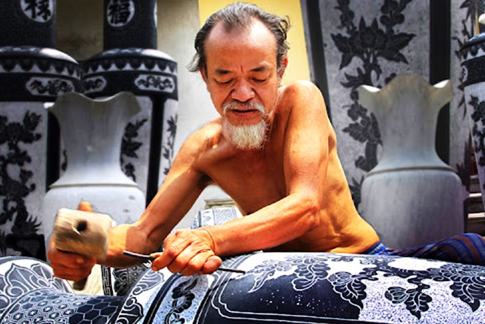 Artisan is carving stone in Ninh Van Village