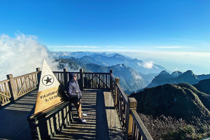 A tourist admiring the scenery at the top of Mount Fansipan, Sapa