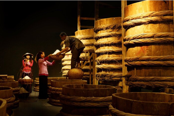 The fermentation process is handled in large wooden barrels