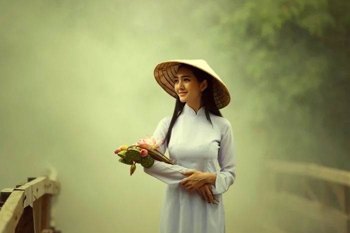 The woman wearing a charming Ao Dai